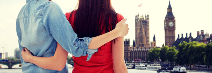 close up of happy lesbian couple over big ben