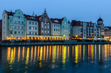 Obraz premium Ethnographic and trade center, embankment of the Fishing Village, night view, Kaliningrad, Russia.