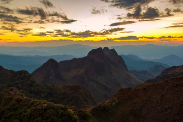 Obraz premium Layer of mountains and mist at sunset time, Landscape at Doi Luang Chiang Dao, High mountain in Chiang Mai Province, Thailand