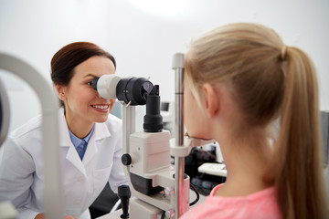 optician with tonometer and patient at eye clinic