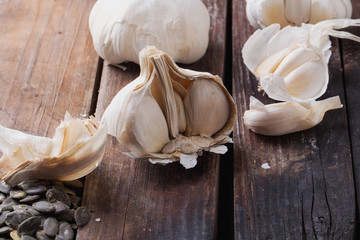 Smoked garlic on the wooden background