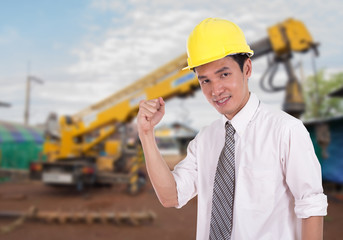 Happy engineer with arm raised, concept of successful, construct