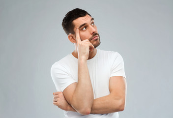 man thinking over gray background