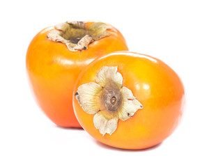 Two persimmons, white background