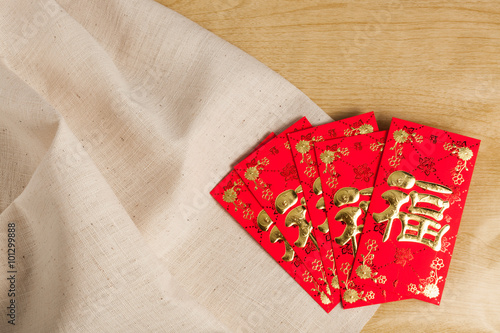 &quot;Chinese New Year Decorations red envelope on wood and gunny sack