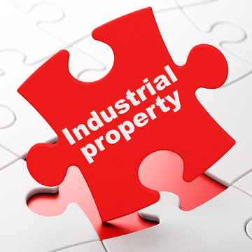 Law concept: Industrial Property on puzzle background