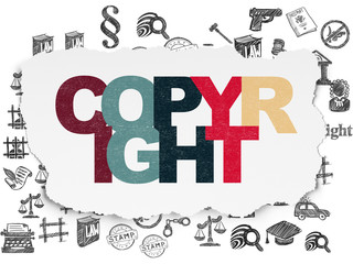 Law concept: Copyright on Torn Paper background