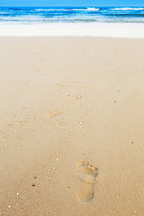 Footprints on sandy beach