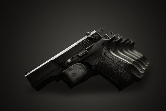 handgun on the black background
