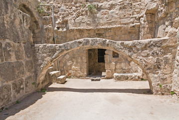 Arch before building entrance in Pool of Bethesda ruins. Old City of Jerusalem, Israel.
