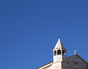 the tower of cathedral against a blue sky