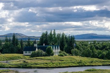 Fototapeta na wymiar Dramatic view of famous Thingvellir with white church, Iceland.