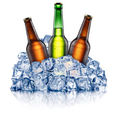 Three cooling beer bottles