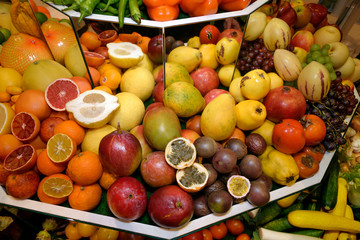 Tropical exotic fruits. Grapefruits, kumquat, mangoes, papayas, pomegranates, persimmons, grapes, passion fruit, guava, carambola