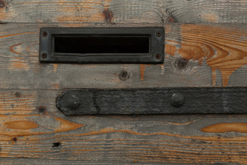 wood door with metal letter slot and metal hinge, Venice, Italy