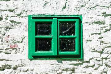 Old window in a brick wall of a country house in west Bohemia