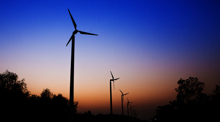 Obraz premium wind turbine sunset background ecosystem for design