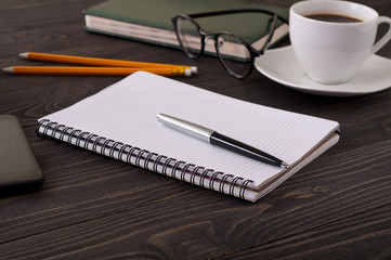 Closeup open notepad with blank pages and pen