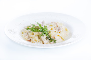 Creamy cream soup with mushrooms and croutons on a white background