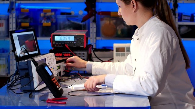 Woman In The Electronics Lab