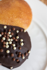 heart shape baking muffins with chocolate on a white plate.