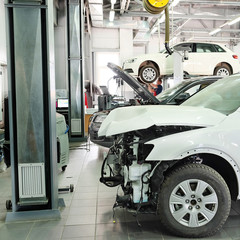 Moscow, Russia, May, 8, 2015: Crashed car in a dealer repair station in Moscow, Russia - obrazy, fototapety, plakaty