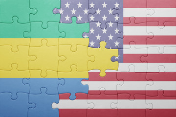 puzzle with the national flag of united states of america and  gabon