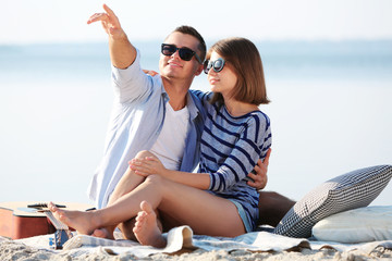 Young couple on the riverside