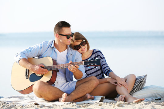 Young couple on the riverside