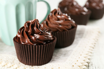 Cupcakes served with a drink on table