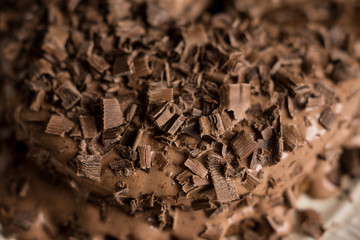 Chocolate cake on the dark rustic background. Shallow depth of field.