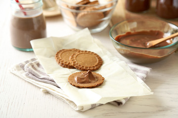 Melted chocolate onplate, on wooden background