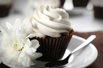 Tasty cupcake on served table, close up