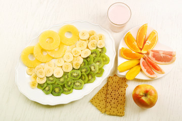 Obraz na płótnie Canvas Fruits on light wooden background. healthy eating concept.