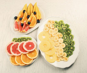 Fruits and vegetables on light wooden background. healthy eating concept.