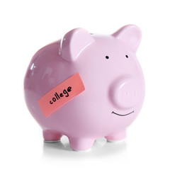 Piggy bank with money for college, isolated on white