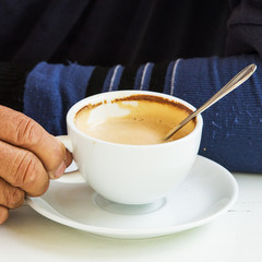 Men holding a coffee cup