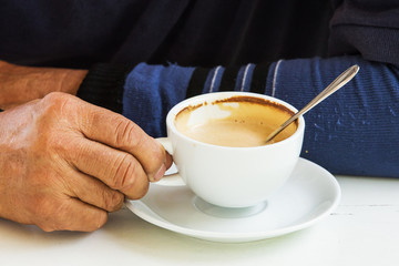 Men holding a coffee cup
