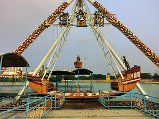Amusement park pirate ship ride abandoned and decaying - landscape photo