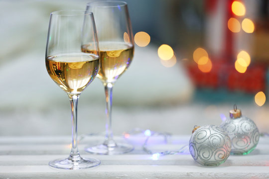 Two glasses of wine on Christmas decoration background