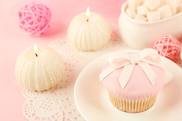 Tasty cupcake with candles and decorations, closeup