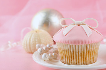 Tasty cupcake with candle and decorations, closeup