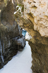frozen mountain river canyon on a winter afternoon