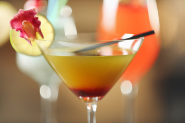 Glasses of cocktails on bar closeup