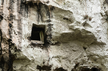 Toraja traditional cave grave carved in the rock