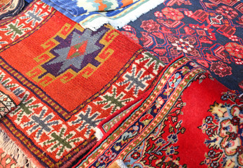 many ancient colored wool carpets made by hand in the Middle Eas