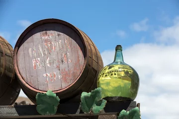 Zelfklevend Fotobehang Barrels and  big bottles with grape wine - malvasia.  Lanzarote, Spain © wjarek