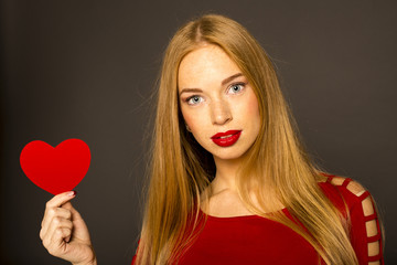 red-haired girl. perfect shot in the studio on a dark background