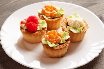 Four cake basket on a white plate