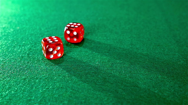 Slow motion of rolling red dice